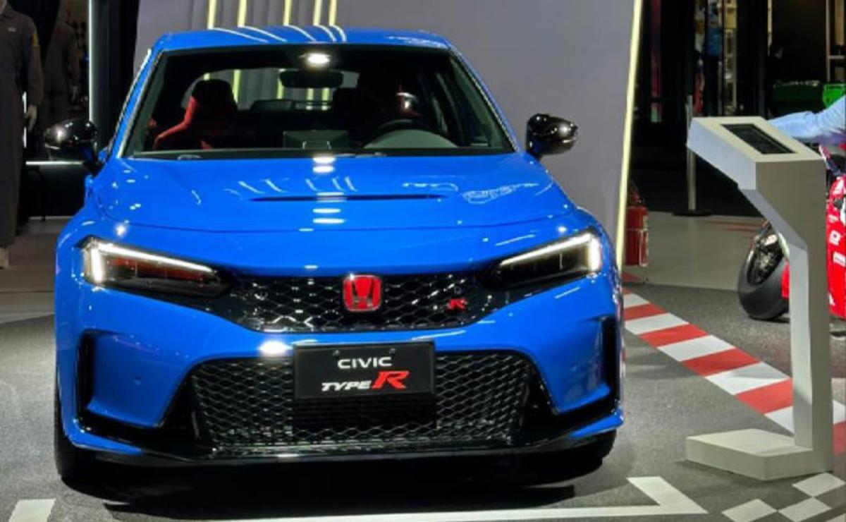 Blue Honda Civic Type R showcased indoors with sleek design.