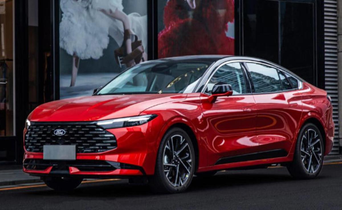 A sleek red sports sedan parked indoors with modern design features.