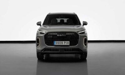Front view of a modern gray SUV with sleek headlights and a prominent grille.