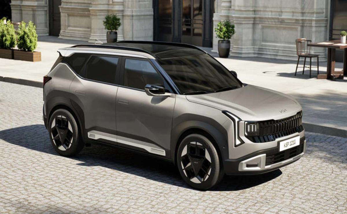 A sleek silver SUV parked on a city street with classic architecture.
