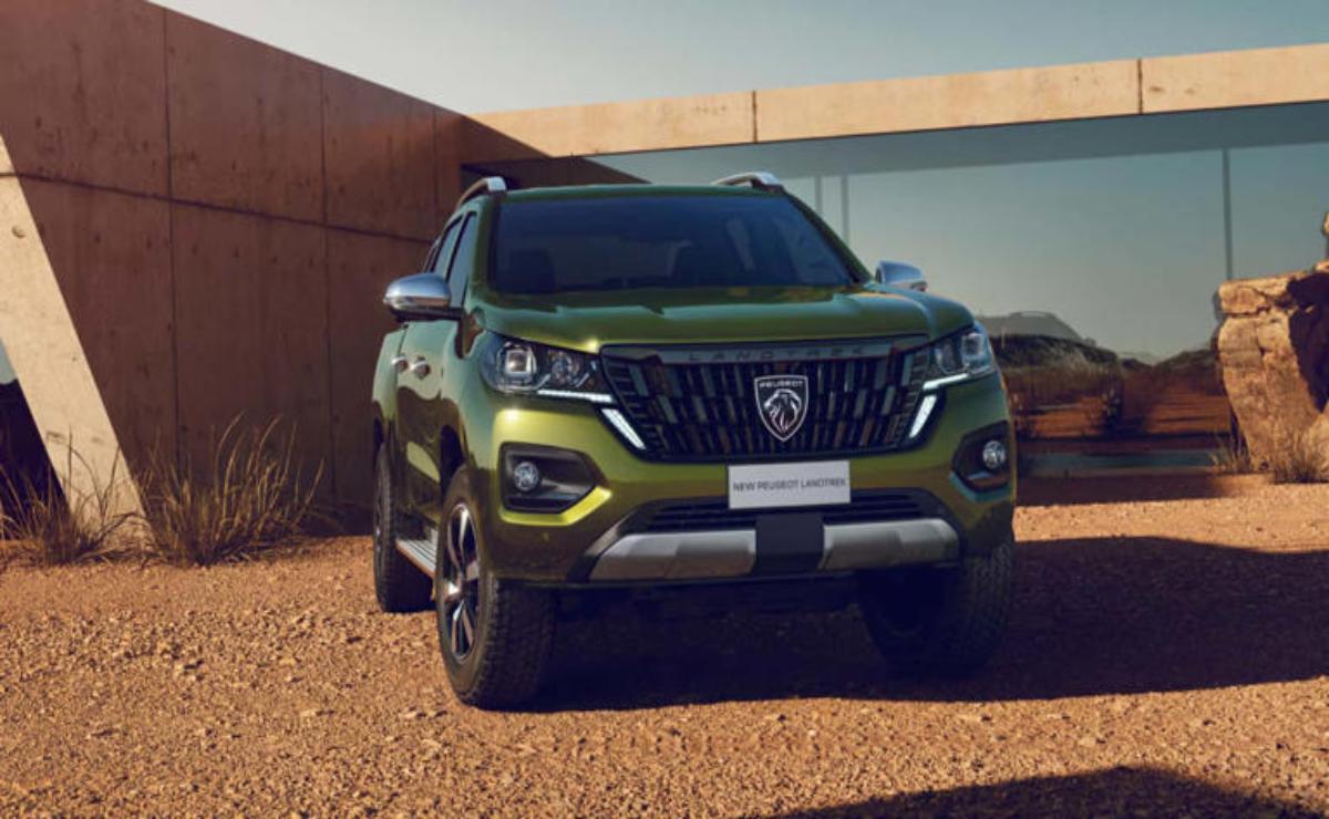 Green SUV parked outdoors with modern design and rugged features.