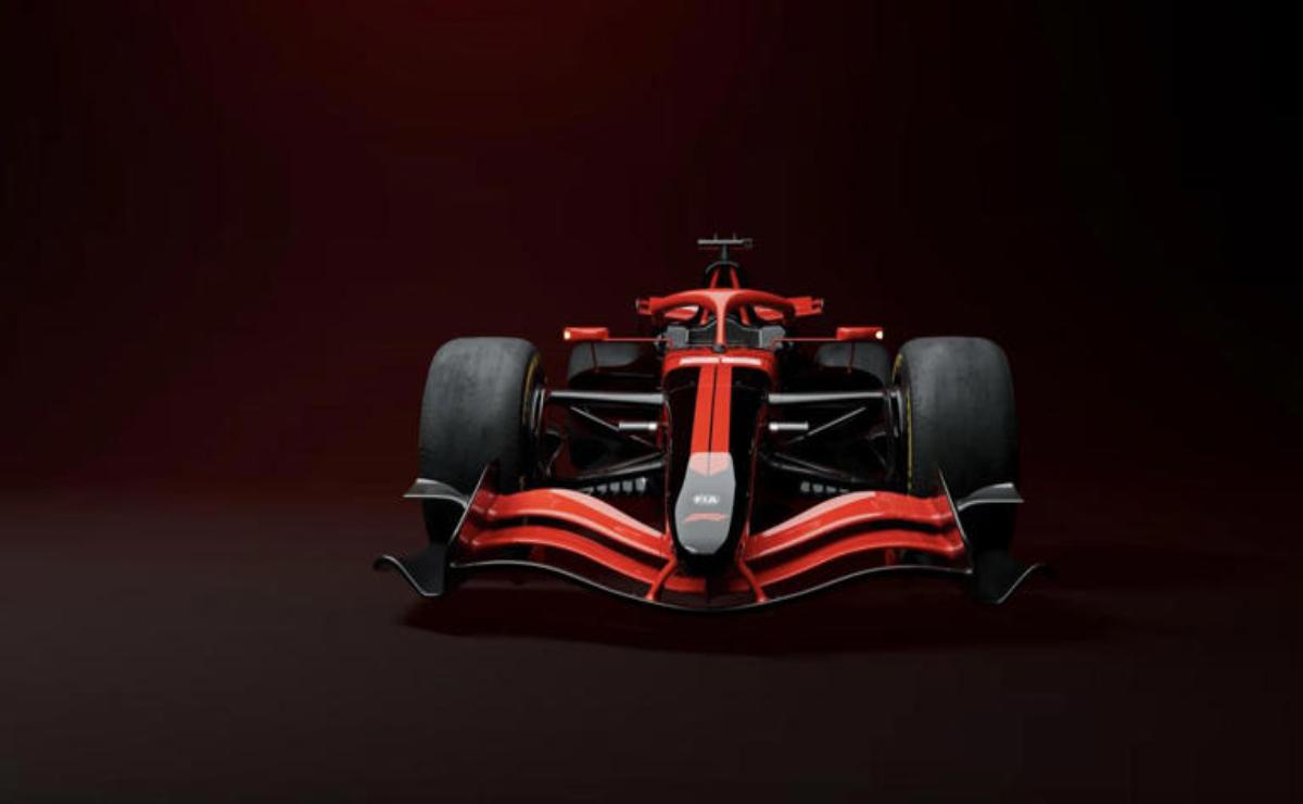 Front view of a sleek red Formula 1 race car under dramatic lighting.