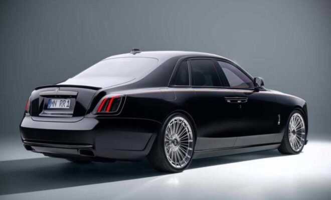 Luxury black sedan with sleek design and stylish alloy wheels.