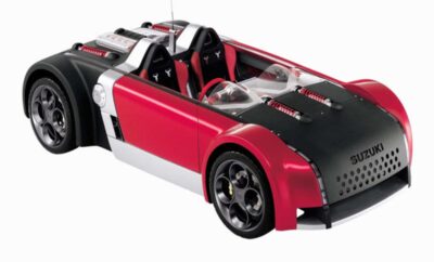 Red and black sporty convertible car with sleek design.