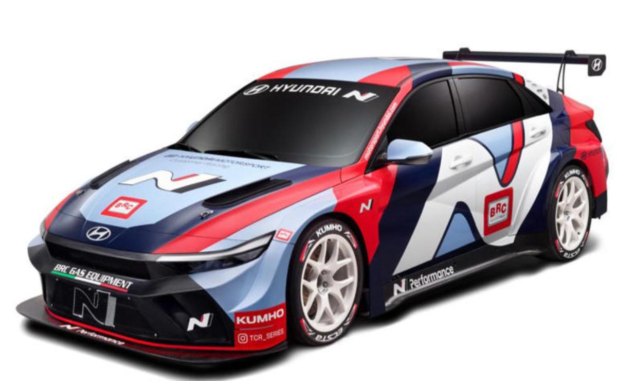 A sleek Hyundai rally car with vibrant red, blue, and white racing livery.