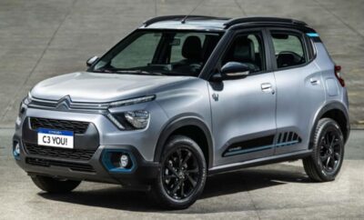 A modern silver compact SUV with black accents parked on a concrete surface.