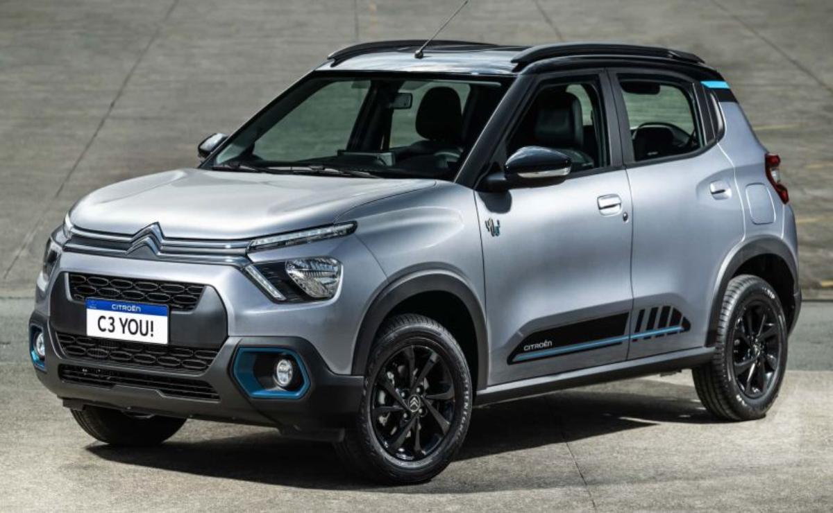 A modern silver compact SUV with black accents parked on a concrete surface.
