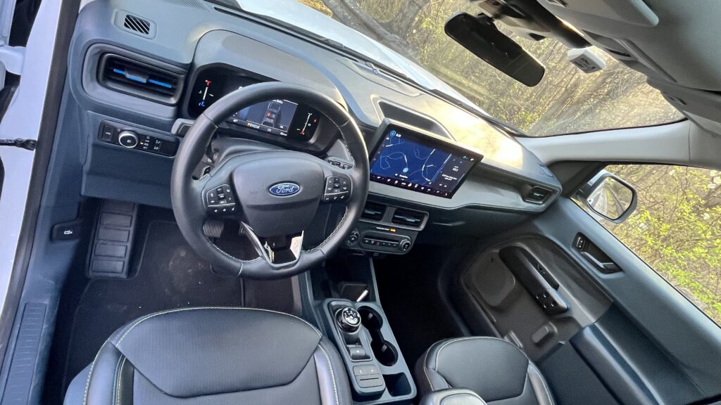 Interior of the 2025 Ford Maverick Lobo with Black Onyx trim, rotary gear selector, and large touchscreen